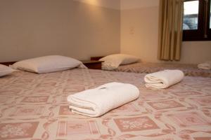 Letto o letti in una camera di Das Heim Hotel