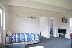 Postel nebo postele na pokoji v ubytování 252 Beachside Motels & Holiday Park + 37 fotografií