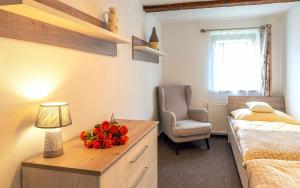 A bed or beds in a room at Apartmány pri Dunajci