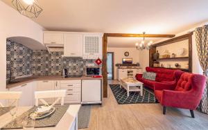 A kitchen or kitchenette at Apartmány pri Dunajci