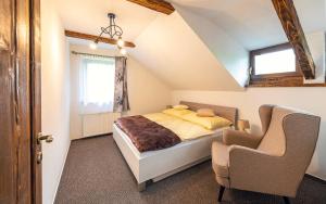 A bed or beds in a room at Apartmány pri Dunajci
