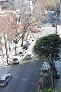 a view of a street with cars parked on the road at AMENABAR SUITES in Buenos Aires