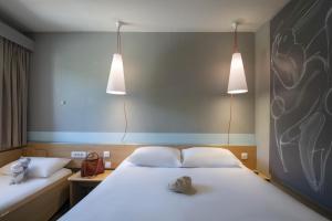 Postel nebo postele na pokoji v ubytování ibis Gap Centre