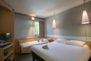 Postel nebo postele na pokoji v ubytování ibis Gap Centre