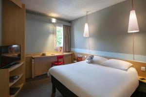 Postel nebo postele na pokoji v ubytování ibis Gap Centre
