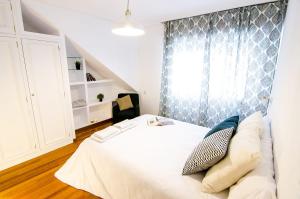 Postel nebo postele na pokoji v ubytování Duplex acogedor CAMINO INGLÉS a 10 min de Santiago