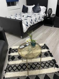 a living room with a coffee table and a bed at BV Lush Studio At Queensgate Huddersfield Town Centre in Huddersfield