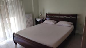 Postel nebo postele na pokoji v ubytování Saint Nektarios House