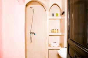 a bathroom with a shower and a sink at Riad Mounir in Marrakesh