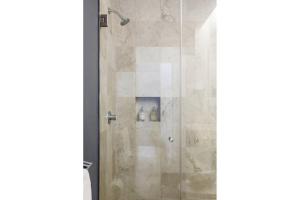 a shower in a bathroom with a glass door at Edificio Remodelado. Frente al Munal. Centro Histórico in Mexico City +26 photos