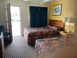 Postel nebo postele na pokoji v ubytování RANGER MOTEL