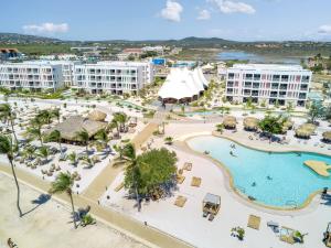 an aerial view of a resort with a pool at Chogogo Dive & Beach Resort Bonaire in Kralendijk