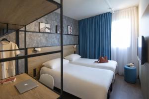 Postel nebo postele na pokoji v ubytování ibis Gap Centre