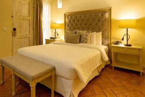 Postel nebo postele na pokoji v ubytování Hotel Casa Canabal by Faranda Boutique