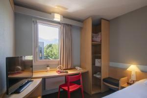 Postel nebo postele na pokoji v ubytování ibis Gap Centre