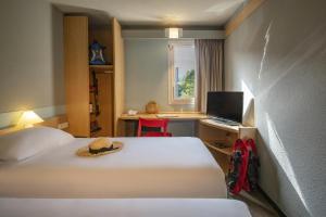 Postel nebo postele na pokoji v ubytování ibis Gap Centre