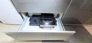 a device in a shelf in a drawer at Tiberias Suite 411 in Tiberias
