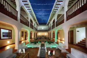 a large pool in a building with a blue ceiling at Hotel Boutique & Spa - VDL Colonial in Villa de Leyva