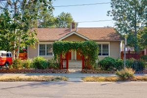 a house with a red door and an arch at Grand Avenue Retreat in Bozeman