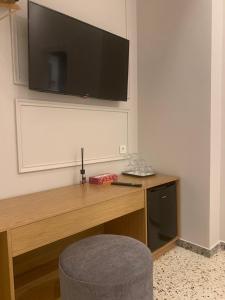 A television and/or entertainment center at A-13 Luxury Rooms at Monastiraki Railway Station
