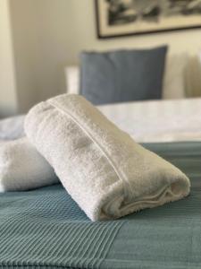 Ein Bett oder Betten in einem Zimmer der Unterkunft Lemon Tree Residence