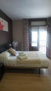 A bed or beds in a room at New J&J Hostel