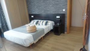 A bed or beds in a room at New J&J Hostel