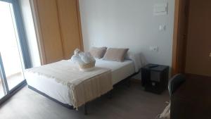 A bed or beds in a room at New J&J Hostel