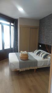 A bed or beds in a room at New J&J Hostel