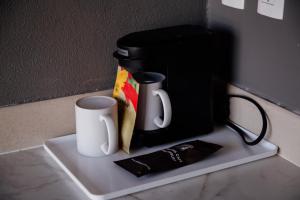 Příslušenství pro přípravu čaje a kávy v ubytování Hotel Rocaval San Cristóbal de las Casas