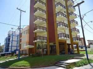 a tall building with balconies on the side of it at Edificio Mirasoles in Villa Gesell