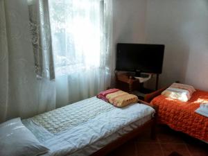 Кровать или кровати в номере Apartments by the sea Brna, Korcula - 17583