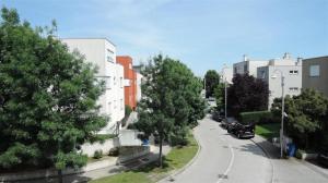 a city street with cars parked on the side of the road at Apartments with a parking space Sveta Nedelja, Prigorje - 17613 in Sveta Nedjelja