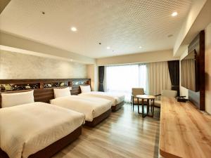 Via Inn Prime Kyotoeki Hachijoguchi客房内的一张或多张床位
