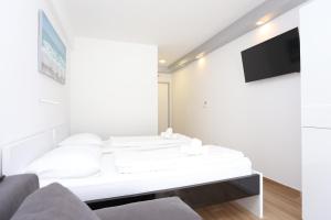 Fotografia z galérie ubytovania Quadruple Room Kastel Stafilic 17710c v destinácii Kaštela