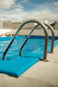 a water slide at a swimming pool at Olympia Hotel in Lorena