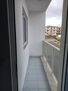 a balcony with a view of a building at New, Modern, and Cozy 3 Bedroom Apartment. in Santa Maria