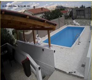 Fotografia z galérie ubytovania Seaside apartments with a swimming pool Pag - 17752 v destinácii Pag