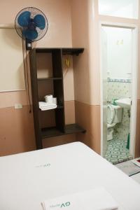 a room with a bathroom with a toilet and a fan at GV Hotel - Catbalogan in Catbalogan