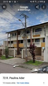 a picture of a apartment building with a building at Triplex ideal para grupos. Acomoda mais de 20. in Curitiba