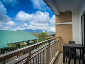 a balcony with a view of the mountains at Bristle Ridge Cozy 2bedroom Residence in Baguio