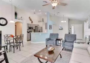 a living room with a couch and a table at Lovely Home in Southern Dunes Golf & Country Club Gated Community in Haines City