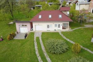 an aerial view of a house with a garage at Apartments for families with children Otocac, Velebit - 18109 in Otočac +11 photos