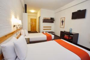 Casa Andina Standard Puno tesisinde bir odada yatak veya yataklar