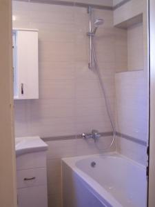 a bathroom with a shower with a tub and a toilet at Apartments by the sea Novalja, Pag - 18154 in Novalja