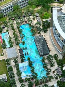 an overhead view of a pool in a resort at Cozy Studio Suite in Taman Anggrek Residences in Jakarta