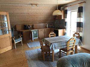 a kitchen and dining room with a table and chairs at Haeberlhaus in Königstein in der Oberpfalz