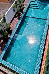 an overhead view of a large blue swimming pool at Amoris Grand Event Space in Muar