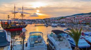 a group of boats docked in a marina at sunset at Tanja in Sveti Vlas