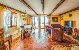 a living room filled with furniture and a table at Lovely Home In Malechowo With Wifi in Malechowo